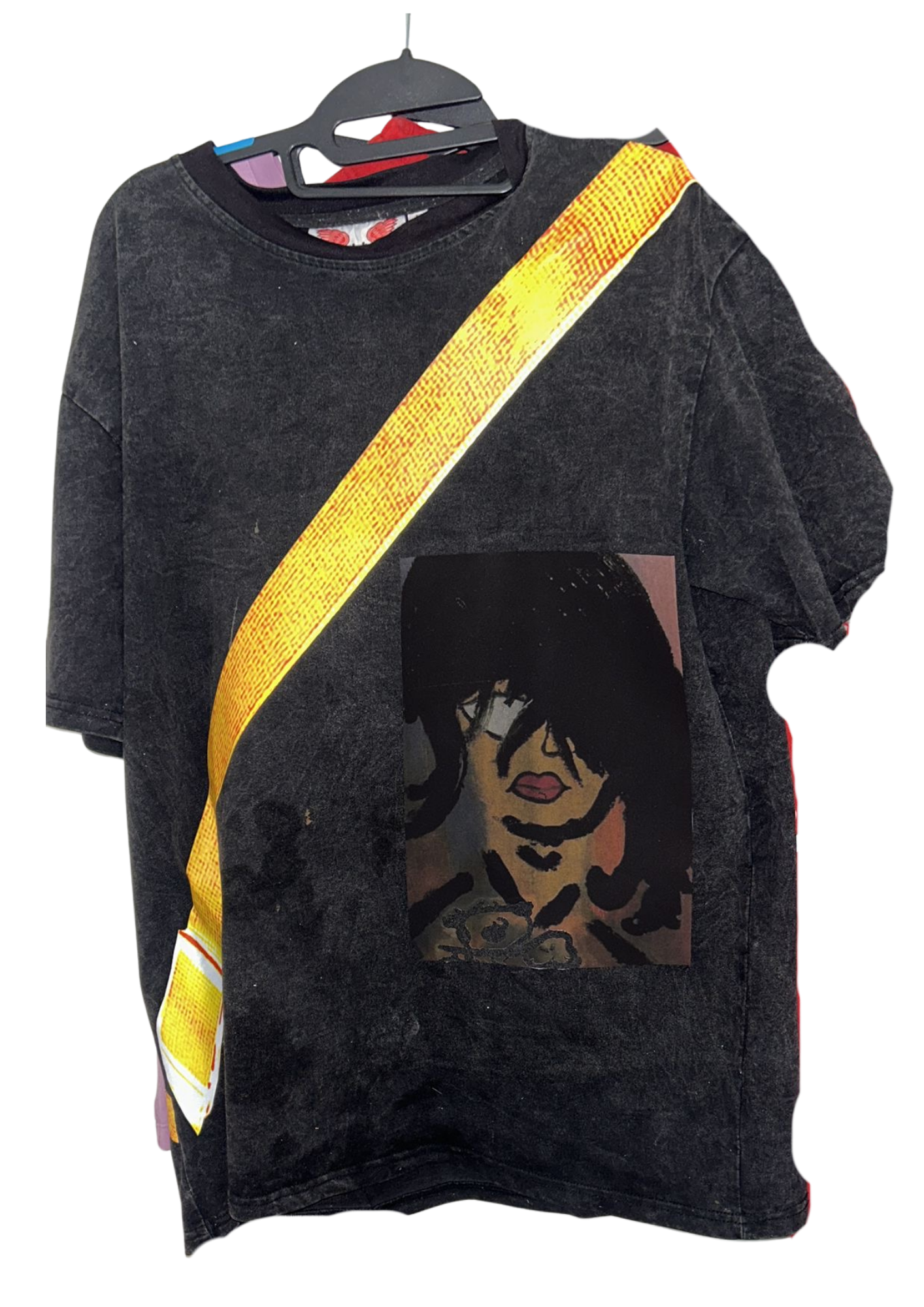 Dark washed tee with diagonal yellow strap graphic and portrait print