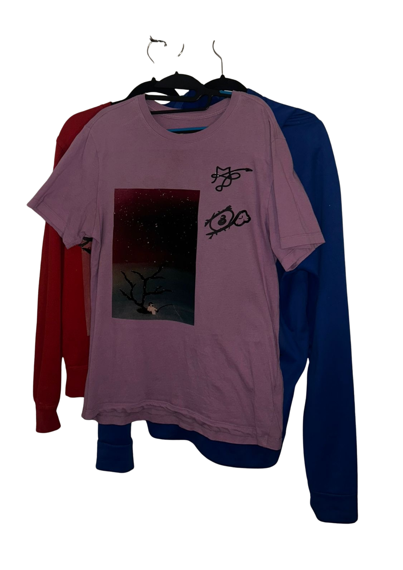 Dusky pink tee layered over red and blue garments