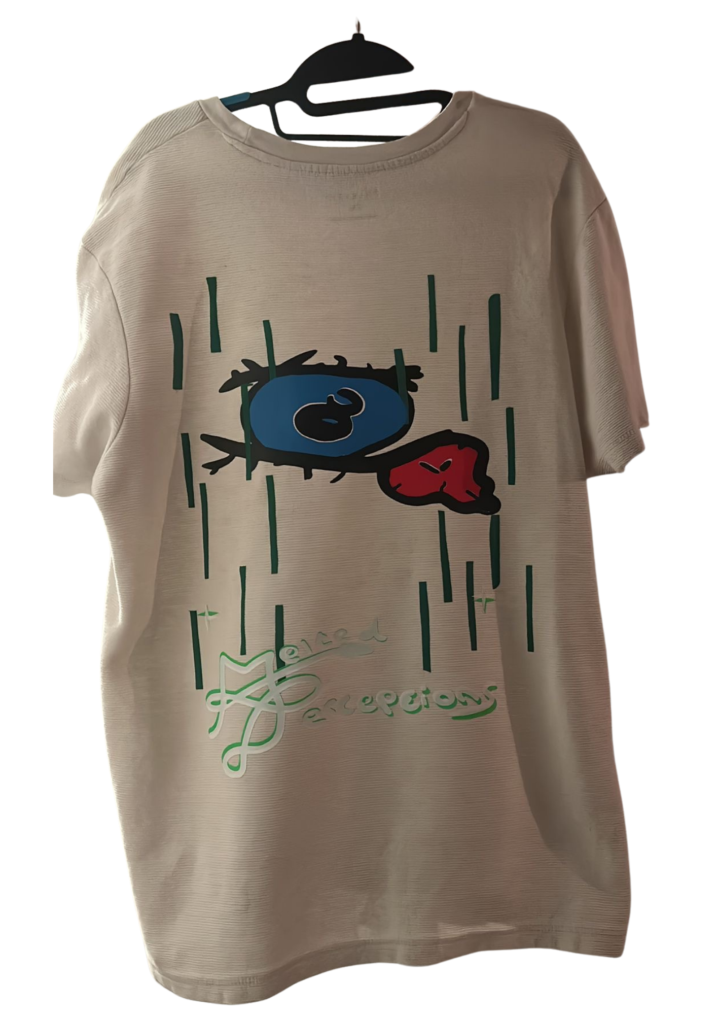 Neutral tee with large eye graphic and green line work