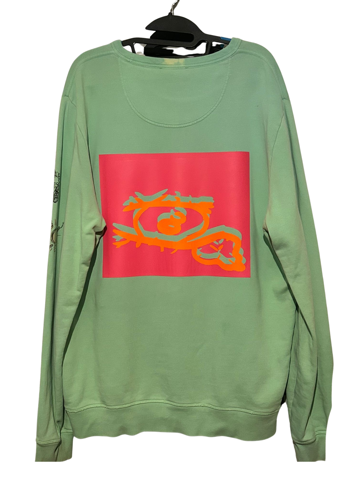 Green Melted Perceptions sweatshirt with bright eye graphic