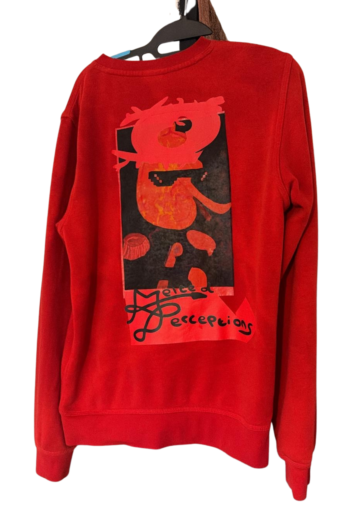 Red crewneck with Melted Perceptions graphic print